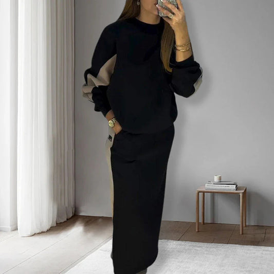 Voľný súprava z farebne blokovaného topu s dlhým rukávom a rozparkovej sukne